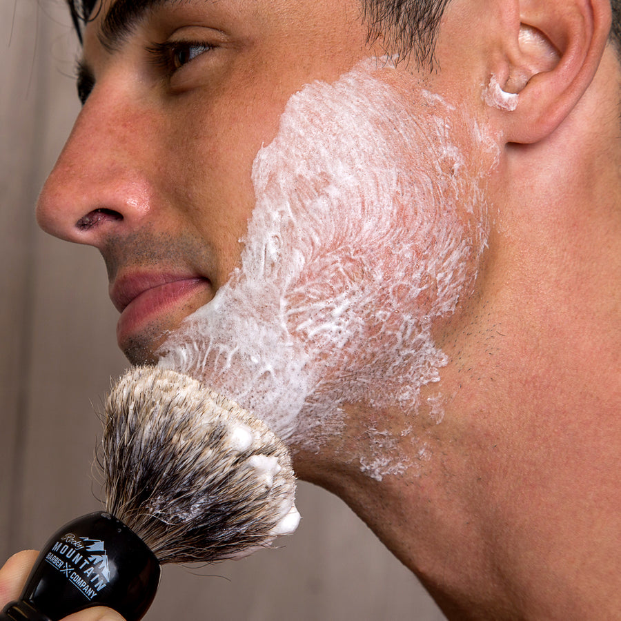 https://rockymountainbarber.com/cdn/shop/products/Applying-Natural-Shaving-Cream-to-Face_900x.jpg?v=1698840251