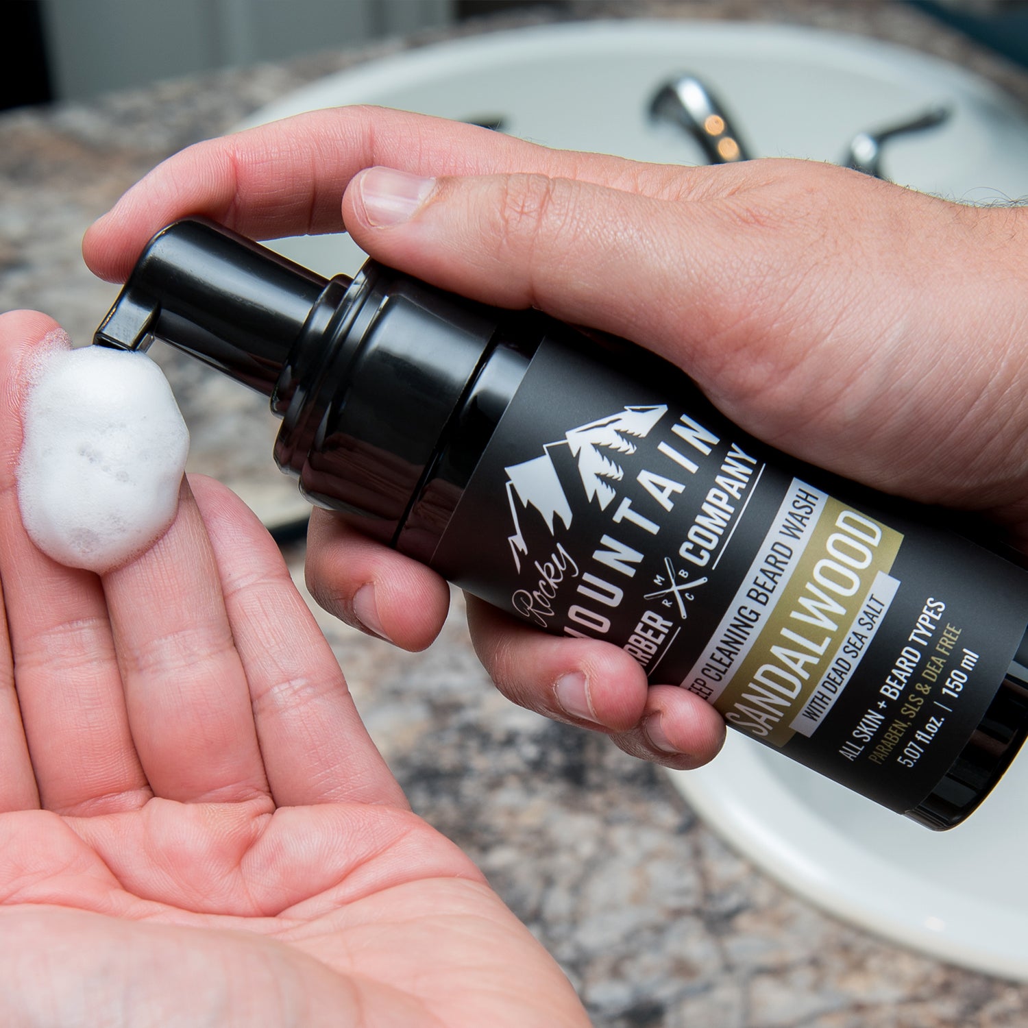 Foaming Sandalwood Beard Wash Dispensed Into Hand